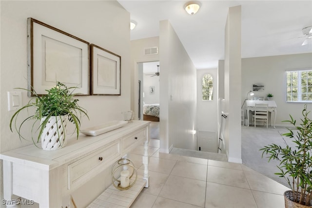 bathroom with ceiling fan, plenty of natural light, tile patterned flooring, and vanity