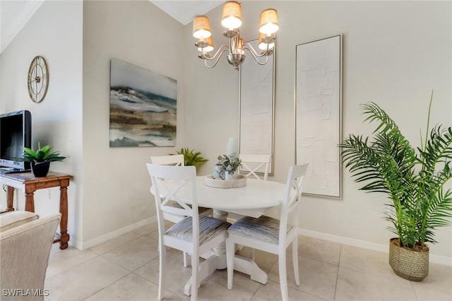 dining space with a notable chandelier and light tile patterned flooring