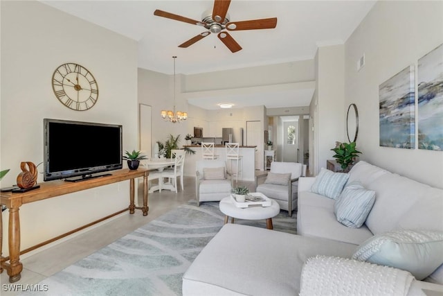 living room featuring ceiling fan with notable chandelier