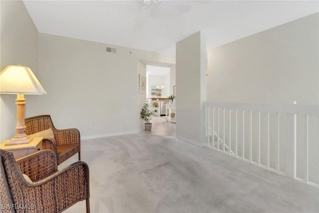 sitting room with carpet floors