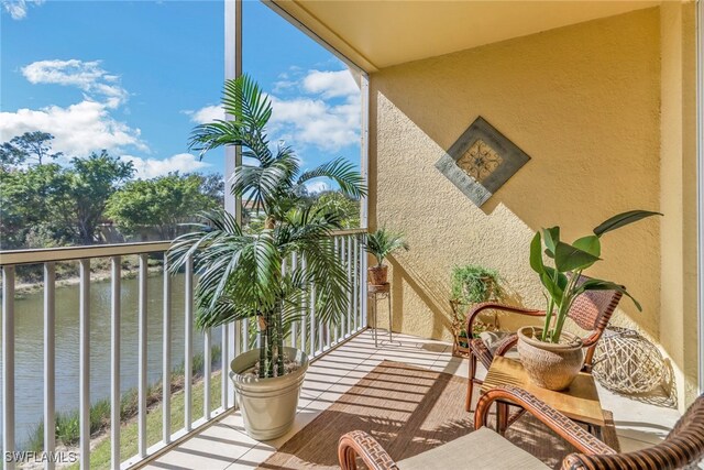 balcony featuring a water view