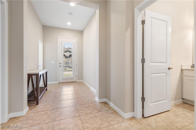 corridor with light tile patterned floors