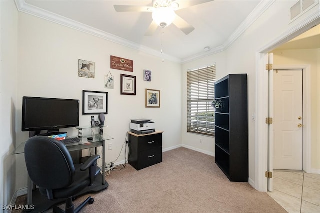 office area featuring light carpet, baseboards, visible vents, a ceiling fan, and ornamental molding