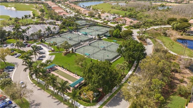 bird's eye view with a residential view, a water view, and golf course view