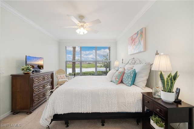 bedroom featuring baseboards, a ceiling fan, light colored carpet, and crown molding