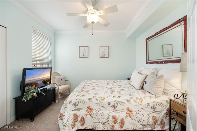 carpeted bedroom with ornamental molding and a ceiling fan