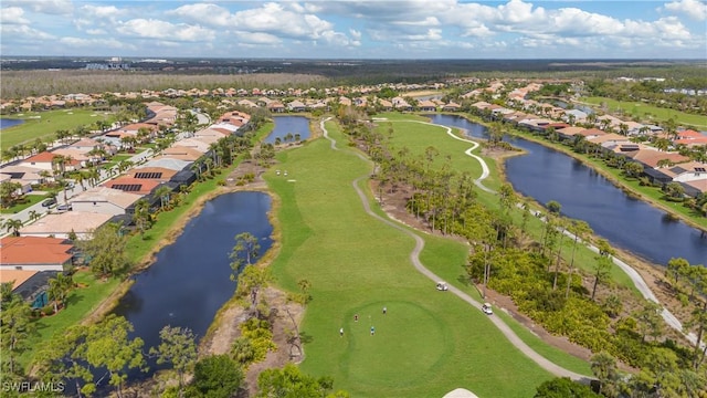 aerial view with a water view, a residential view, and golf course view