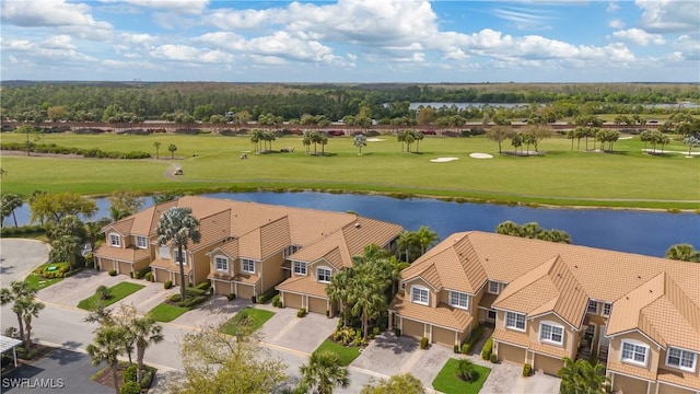 bird's eye view with view of golf course, a water view, and a residential view