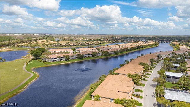 birds eye view of property featuring a water view and a residential view