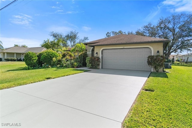 view of front of property with stucco siding, central AC unit, a garage, driveway, and a front lawn