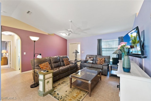 living room featuring lofted ceiling, light tile patterned floors, and ceiling fan