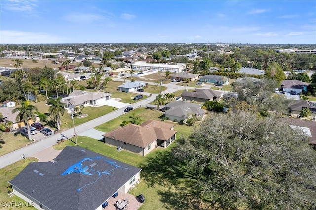 birds eye view of property with a residential view