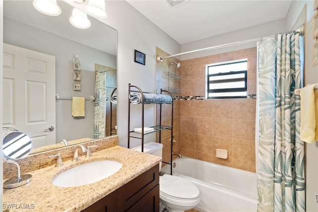 full bathroom featuring shower / bathtub combination with curtain, vanity, and toilet