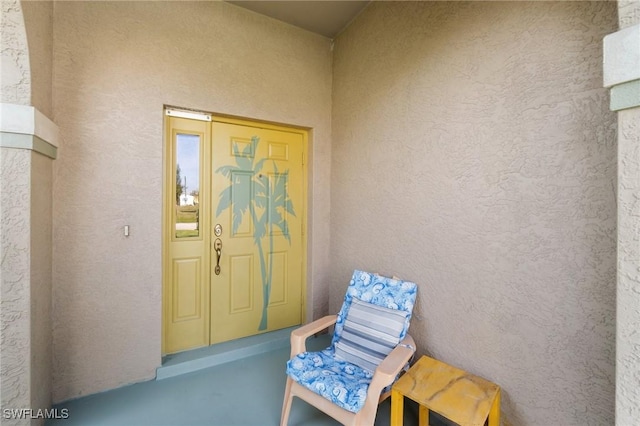 doorway to property with stucco siding