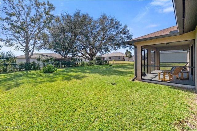 view of yard with a patio area and a sunroom