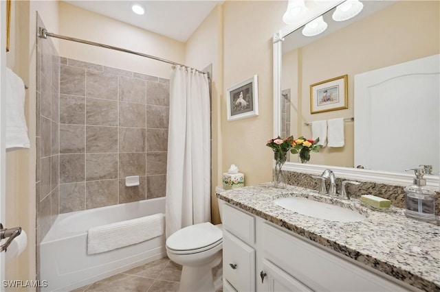 full bathroom with shower / tub combo, vanity, tile patterned floors, and toilet