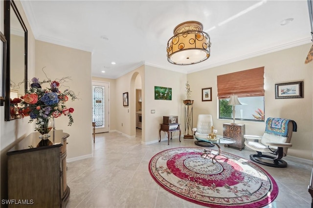 living area with ornamental molding and light tile patterned flooring