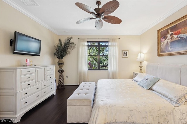 bedroom with dark wood-type flooring, ornamental molding, and ceiling fan