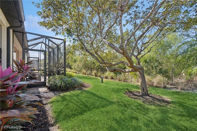 view of yard featuring glass enclosure