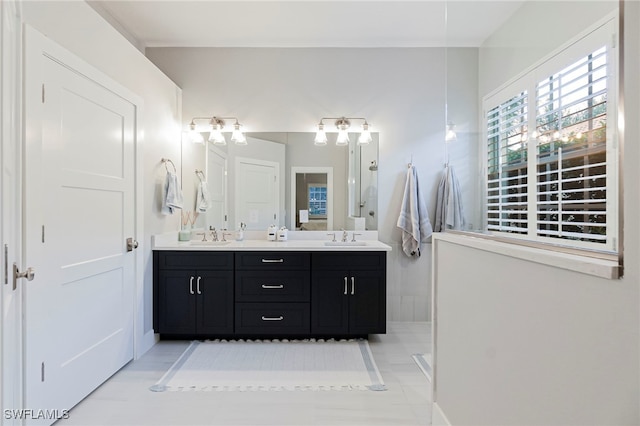 bathroom featuring tile patterned flooring and vanity