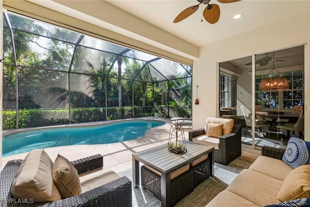 view of swimming pool featuring ceiling fan, an outdoor hangout area, a patio, and a lanai