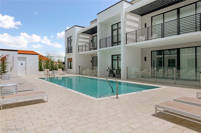 view of pool featuring a patio