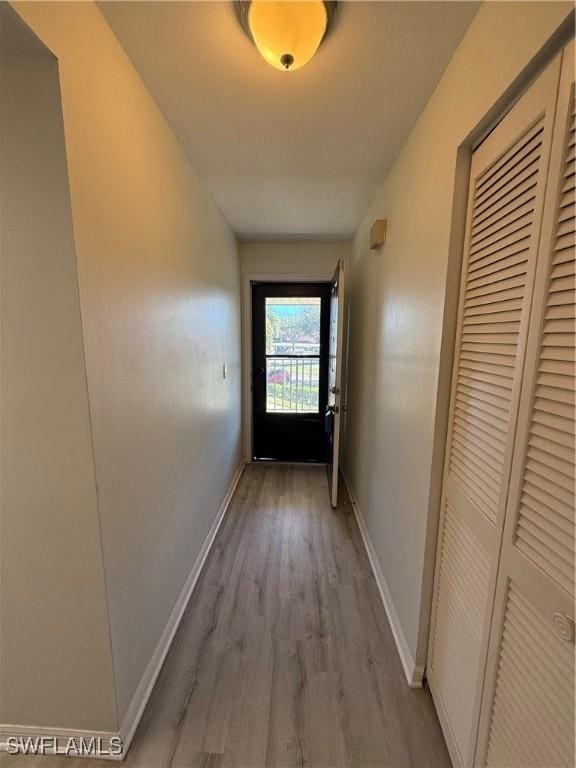 hall with light hardwood / wood-style floors