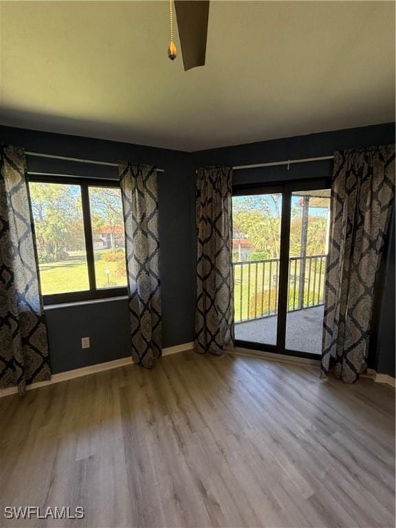 spare room with wood-type flooring