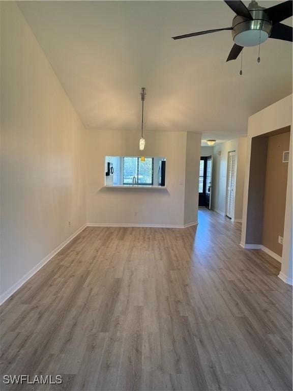 interior space featuring ceiling fan, lofted ceiling, and hardwood / wood-style floors