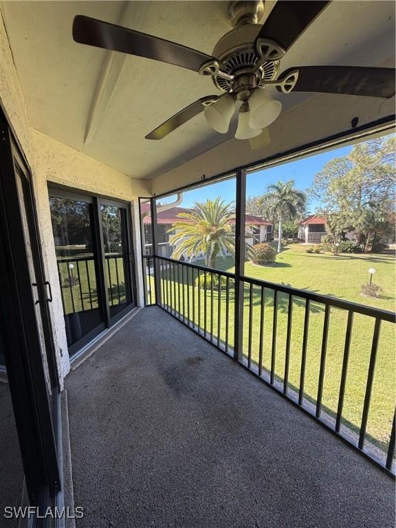 exterior space featuring ceiling fan