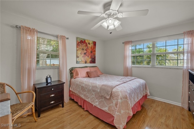 bedroom featuring ceiling fan and light hardwood / wood-style flooring