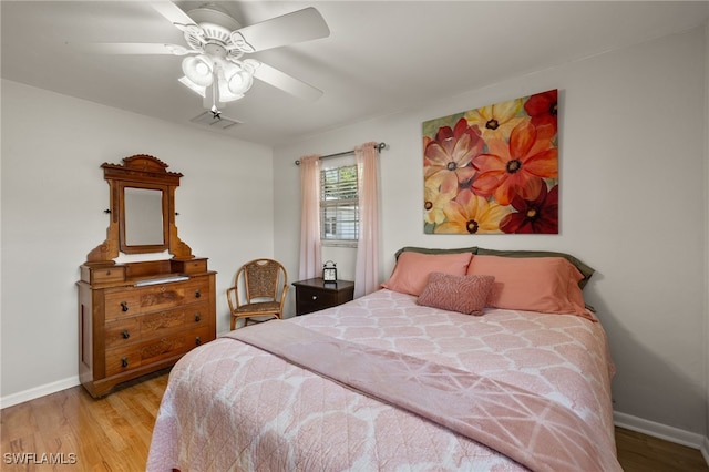 bedroom featuring ceiling fan and light wood-type flooring