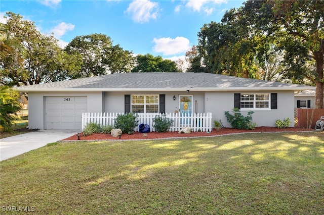 single story home featuring a garage and a front yard