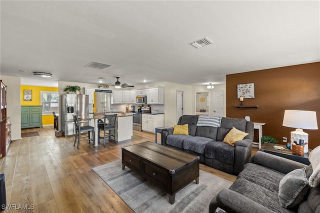 living room featuring light wood-type flooring