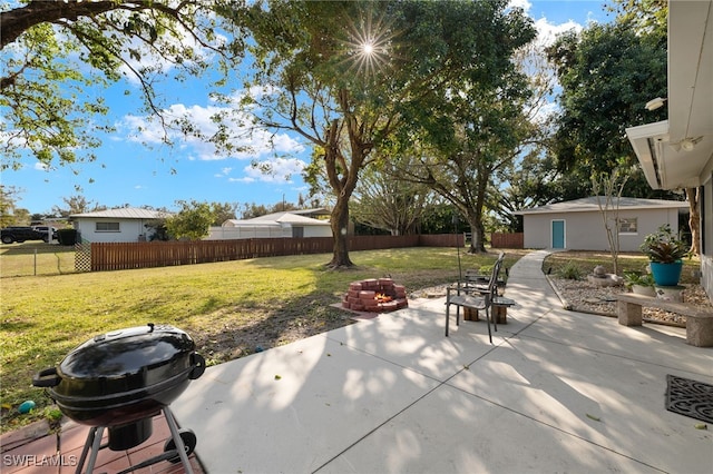 view of patio / terrace featuring a grill and a fire pit