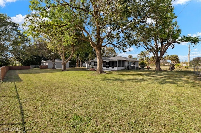 view of yard with a sunroom