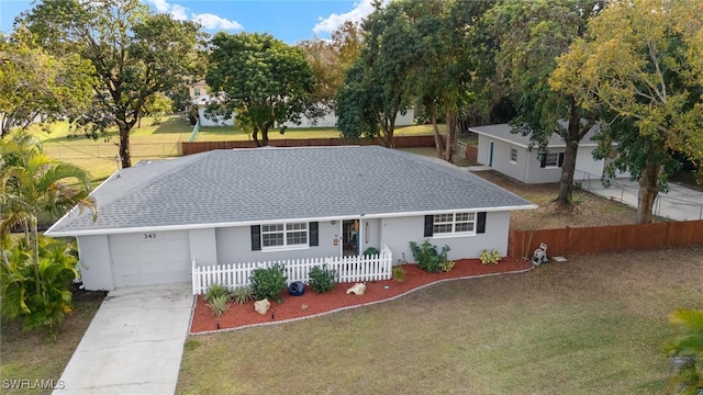 ranch-style home featuring a garage