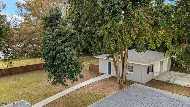 obstructed view of property featuring a front yard