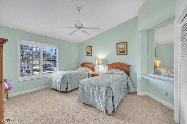 carpeted bedroom with lofted ceiling and ceiling fan