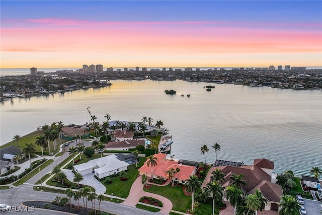 aerial view at dusk with a water view