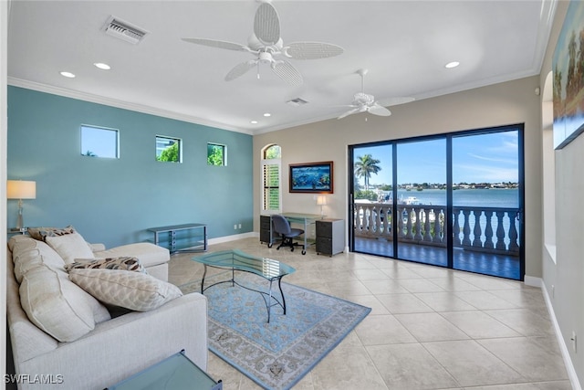 tiled living room featuring ornamental molding, a water view, and ceiling fan