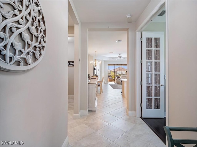 hallway featuring light tile patterned floors