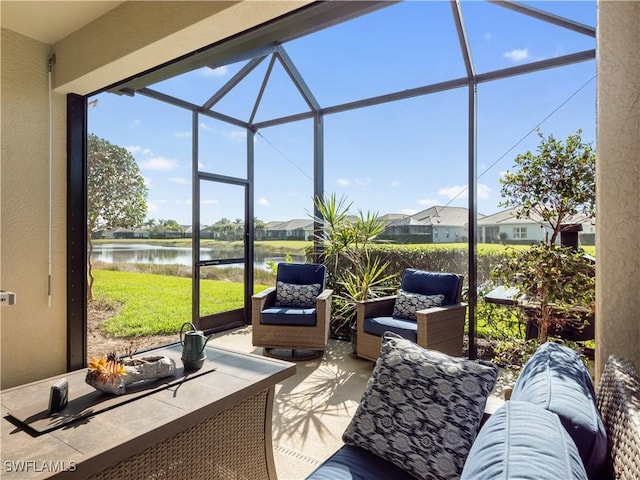 sunroom / solarium with a water view