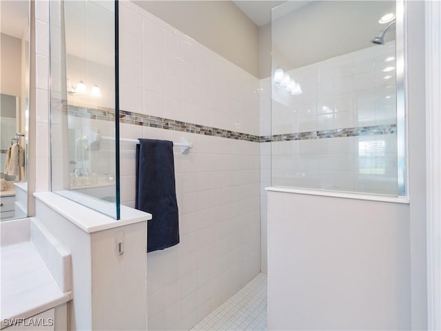 bathroom with tiled shower