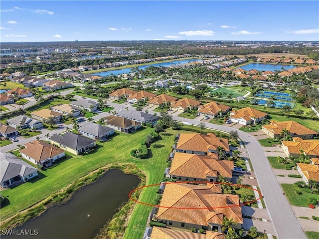 birds eye view of property with a water view