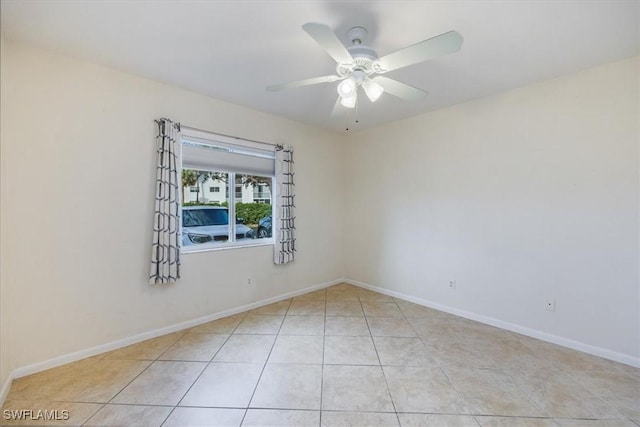 unfurnished room featuring ceiling fan and light tile patterned floors