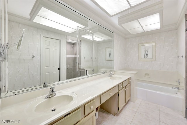 bathroom with tile patterned floors, vanity, and independent shower and bath