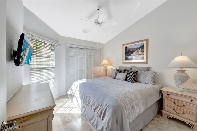 bedroom featuring vaulted ceiling, ceiling fan, and a closet