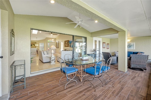 dining space featuring vaulted ceiling and ceiling fan