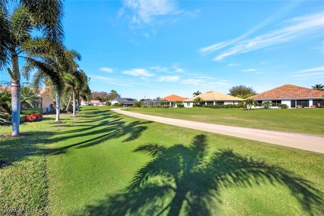 view of home's community with a yard